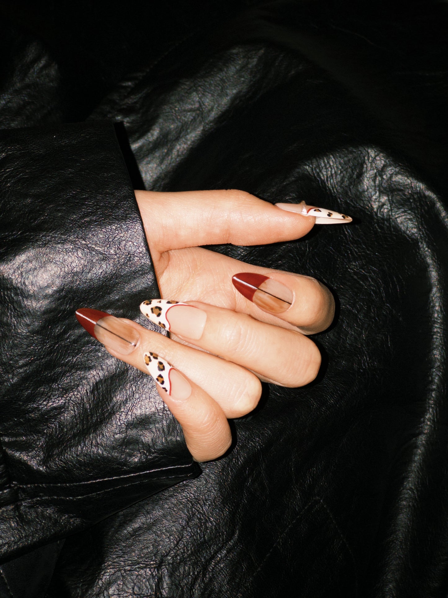 Miss Rouge press-on nails — red with leopard spots, long almond shape | Ochic