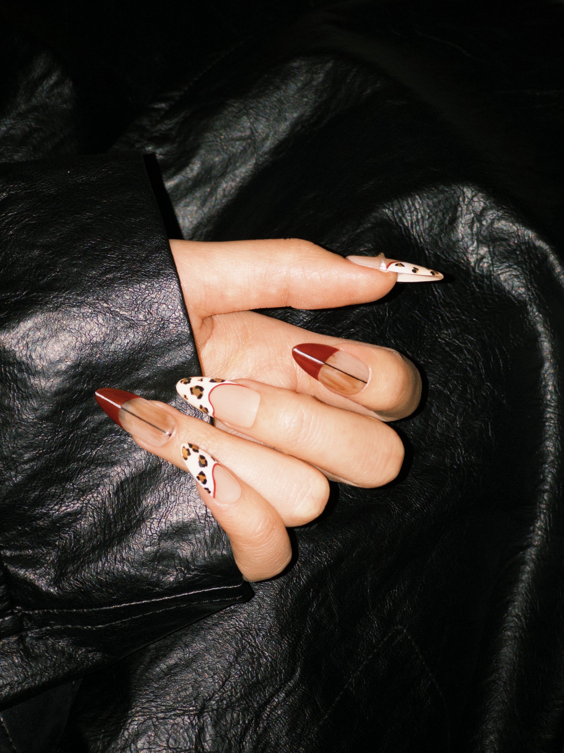 Miss Rouge press-on nails — red with leopard spots, long almond shape | Ochic